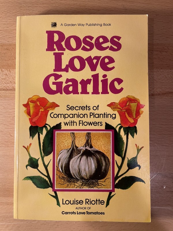 Roses Love Garlic: Secrets of Companion Planting with Flowers by Louise Riotte