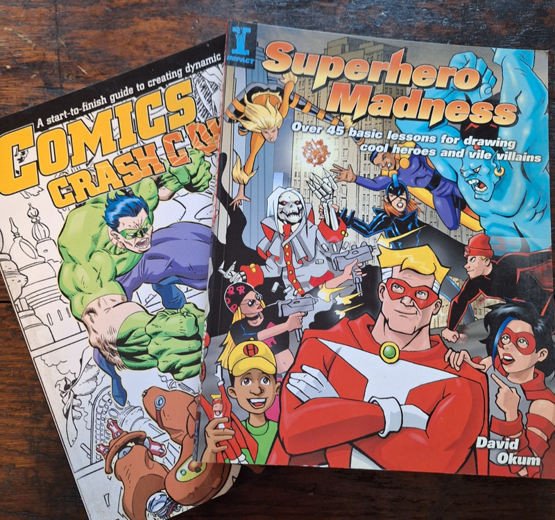 Lot of 2 Superhero Madness Paperback David Okum & Comics Crash Course IMPACT